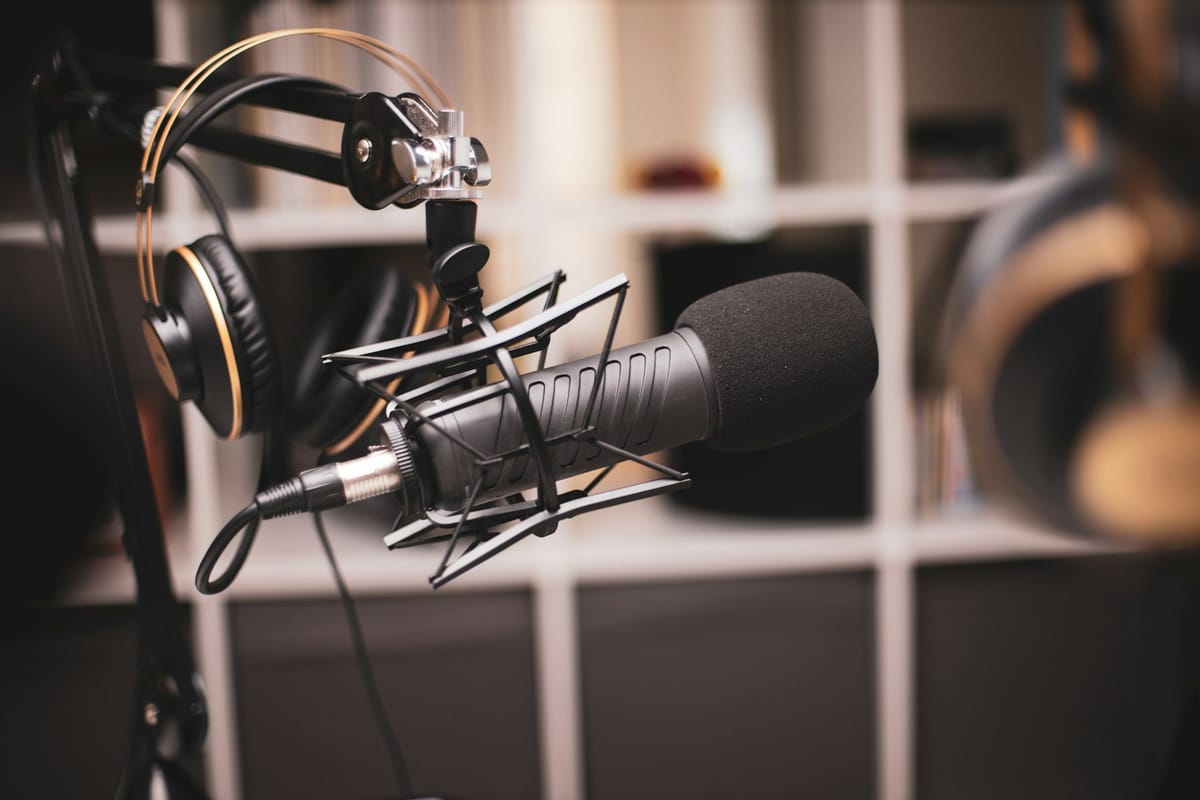 A studio microphone and headphones ready for a recording